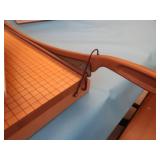 OVERSIZED PAPERCUTTER AND BOOKS