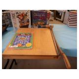 OVERSIZED PAPERCUTTER AND BOOKS