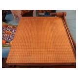 OVERSIZED PAPERCUTTER AND BOOKS