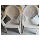 Two Plastic Patio Chairs