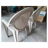 Two Plastic Patio Chairs