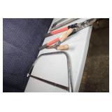 Collection of Hand Tools Including Pruning Shears, Bow Saw, and Hacksaw