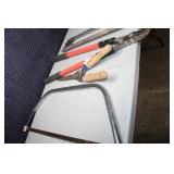 Collection of Hand Tools Including Pruning Shears, Bow Saw, and Hacksaw
