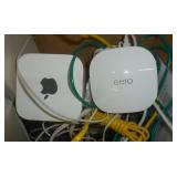 Box of computer speakers and apple eero wifi extender