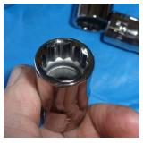 Group of misc wrenches and a new set of craftsman metric 1/2 in sockets