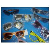 18 pair of new sunglasses mostly adult