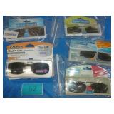 9 pair of clip on sunglasses various size