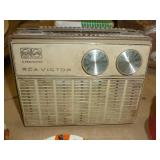 Vintage airplane with folding wings, RCA/Victor radio, jewelry, trick magnetic dogs, hair pin, Shoe horns