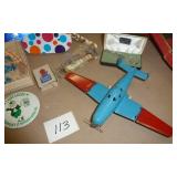 Vintage airplane with folding wings, RCA/Victor radio, jewelry, trick magnetic dogs, hair pin, Shoe horns