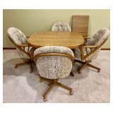 Shell Kona Dining Set with Table, 4 Fabric Castor Swivwl Chairs, and 1 Leaf