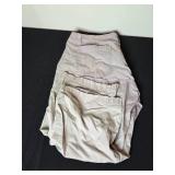 Assortment of Clothing and Gear Including Pants, Backpack, and Towels