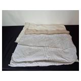 Assortment of Clothing and Gear Including Pants, Backpack, and Towels