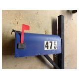 Used Blue Mailbox with Mounting Pole and Red Flag