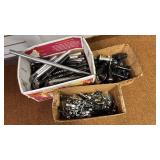 Collection of Bicycle Parts: Seat Posts, Hubs, and Wheel Skewers