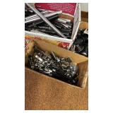Collection of Bicycle Parts: Seat Posts, Hubs, and Wheel Skewers