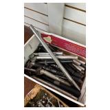 Collection of Bicycle Parts: Seat Posts, Hubs, and Wheel Skewers