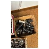 Collection of Bicycle Parts: Seat Posts, Hubs, and Wheel Skewers