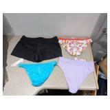 (4) NEW WOMENS ASSORTED SWIMWEAR BOTTOMS (LARGE)