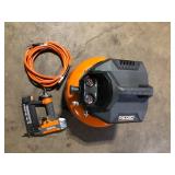 RIDGID 6 Gal. 150 PSI Portable Electric Oil-Free Jobsite Pancake Air Compressor with 25 ft. Air Hose and 18GA Brad Nailer   Customer Returns See Pictures
