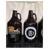 13 Half-gallon beer growlers from breweries around Minnesota