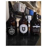 13 Half-gallon beer growlers from breweries around Minnesota