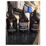 13 Half-gallon beer growlers from breweries around Minnesota
