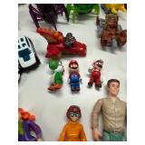 Collection of Assorted Action Figures and Toy Cars