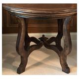 Round Wooden Table with Ornate Detailing