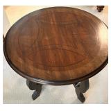Round Wooden Table with Ornate Detailing