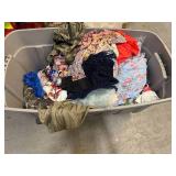 Bin of shirts, socks, belts, pants