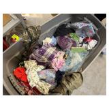 Bin of shirts, socks, belts, pants