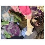 Bin of shirts, socks, belts, pants