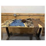 Bin of shirts, socks, belts, pants