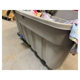 Bin of shirts, socks, belts, pants