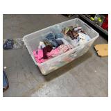 Bin of shirts, pants, belts, socks