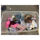 Bin of shirts, pants, belts, socks