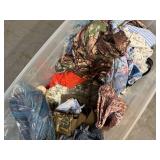 Bin of shirts, pants, belts, socks