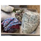 Bin of pillows, blankets, bed sheets, sofa covers