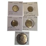 Five silver world coins from different denominations and countries in very nice condition.