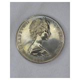 Three large commemorative world coins in nice condition, from different countries.