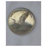 Three large commemorative world coins in nice condition, from different countries.