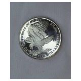 Three large commemorative world coins in nice condition, from different countries.