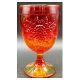 Fenton Amberina Hobnail Three Footed Egg, L.E. Smith Amberina Grape & Leaf Pattern Water Glass, and Jeanette Glass Covered Candy Dish