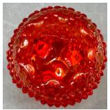 Fenton Amberina Hobnail Three Footed Egg, L.E. Smith Amberina Grape & Leaf Pattern Water Glass, and Jeanette Glass Covered Candy Dish