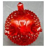 Fenton Amberina Hobnail Three Footed Egg, L.E. Smith Amberina Grape & Leaf Pattern Water Glass, and Jeanette Glass Covered Candy Dish