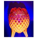 Fenton Amberina Hobnail Three Footed Egg, L.E. Smith Amberina Grape & Leaf Pattern Water Glass, and Jeanette Glass Covered Candy Dish