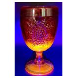 Fenton Amberina Hobnail Three Footed Egg, L.E. Smith Amberina Grape & Leaf Pattern Water Glass, and Jeanette Glass Covered Candy Dish