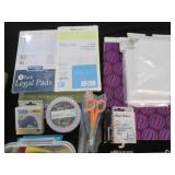 Variety of note pads, scissors and ...