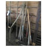 Bundle of pitchforks, hoes, pickaxe...