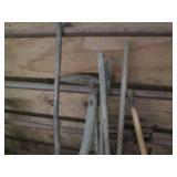 Bundle of pitchforks, hoes, pickaxe...